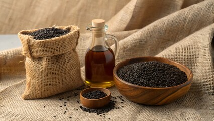 Black Cumin Seeds Still Life Featuring Oil, Bowls, and a Burlap Sack