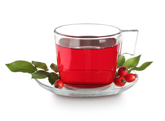 Glass cup of hot rose hip tea and berries on white background