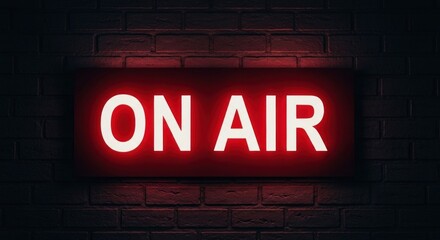 Red lit "ON AIR" sign glows against a textured brick wall