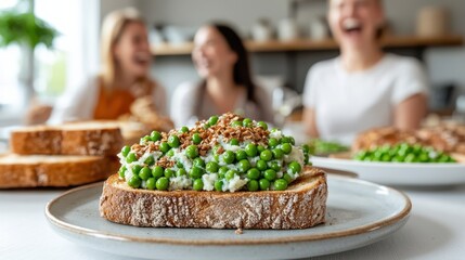 Close-up of Pea Toast on Plate with Laughing Women in Background, Showcasing Friends Enjoying a Meal Together