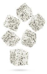photographic illustration of freshly diced cubes of white dragon fruit, also known as pitaya, with black seeds, dynamically arranged and isolated on a transparent background.