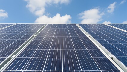 Obraz premium Rows of solar panels under blue sky with clouds. Modern technology for renewable energy production, offering eco-friendly and sustainable solutions for homes and businesses