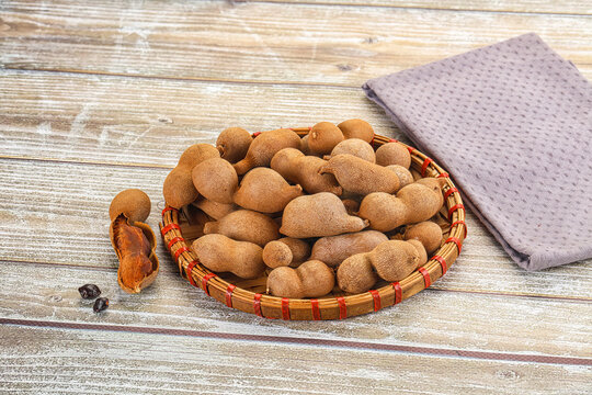 Tropical exotic Tamarind fruit heap