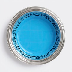 Overhead view of a round, shallow dish.  A vibrant turquoise blue ceramic surface is framed by a perforated, metallic silver rim
