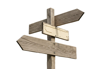 Isolated directional wooden signpost with three blank signs pointing in different directions
