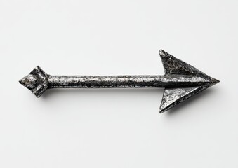 A weathered, metallic arrow-shaped object,  pointing right, rests on a plain background