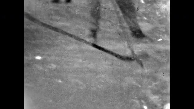People play active winter sport hockey, abstract fast movement. Healthy fun recreation in frozen snow nature. Team active game in cold outdoor. Vintage activities in old film. Archival retro archive
