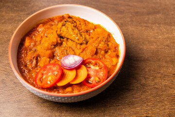 Mpotompoto, Mashed Yam or Potato Cooked into a Thick Porridge with Palm Oil, Tomatoes, Onions, Dried Fish, and Tuna, a Traditional Ghanaian Dish from West Africa