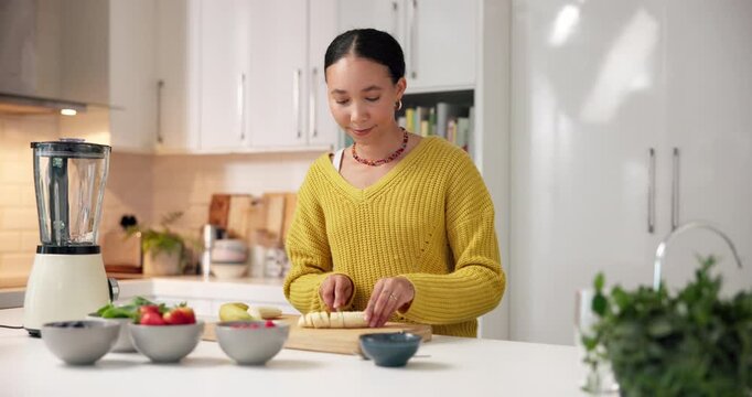 Blender, cutting and woman in house with banana, fruit and benefits in morning shake. Organic, drink prep or person at kitchen mixer with detox diet, gut health or digestion in breakfast juice.