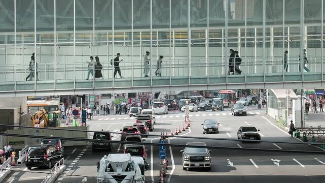 Tokyo Scene : Pedestrian and Vehicle Separation Structure. People Passing Through an Elevated Walkway that Crosses Over the Street in Front of Shibuya Station  |  Shibuya, Tokyo, Japan