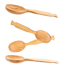 isolated photograph of four unique handcrafted natural wood cooking spoons positioned at different angles on a clean transparent background.