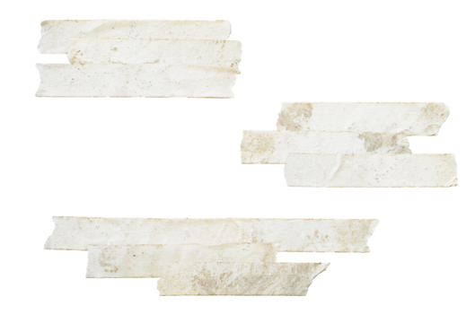 photograph of two clusters of layered and overlapping pieces of distressed, grungy beige masking tape isolated on a clean transparent background.
