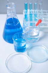 Close-up of laboratory glassware equipment test tube beaker flask scientific experiment pharmaceutical healthcare and medicine DNA vaccine innovation development research experiment analysis education