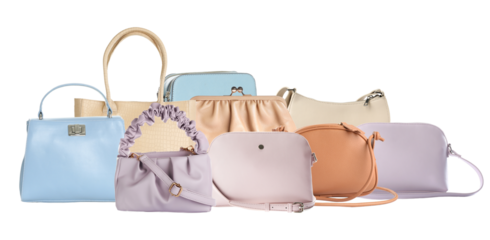 a close-up studio photograph showcasing a variety of fashionable women's handbags neatly grouped together in soft pastel colors isolated on black.