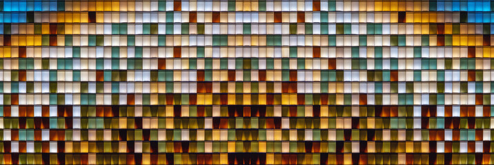 Fototapeta premium Colorful transparent glass bricks forming a decorative wall