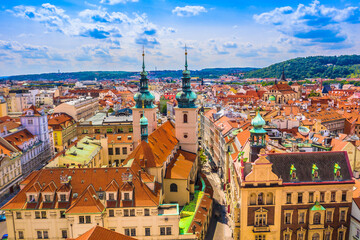 Drone image of Prague skyline showing gothic towers, red rooftops, historic bridges, and the beautiful blend of medieval and baroque architecture in the Czech capital