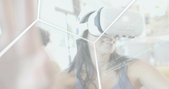 Woman wearing VR headset activating transparent honeycomb grid and guiding code lines for tech demo