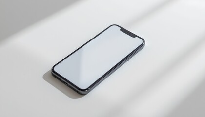 an open smartphone is placed on a flat surface with sunlight filtering through, creating a soft, diffused light across the phone and its shadow