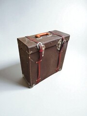 Old-fashioned leather film bag on a white background.