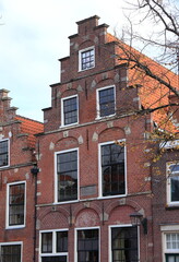 Traditional Brick House Facade with Stepped Gable in Haarlem, Netherlands