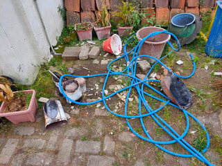 Outdoor Garden Mess With Tools and Pots