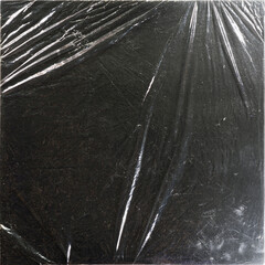 Square black album cover with plastic wrap texture