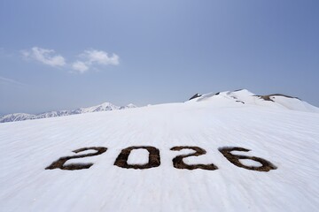 2026 written in snow on mountain slope