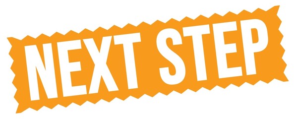 NEXT STEP text written on orange stamp sign.