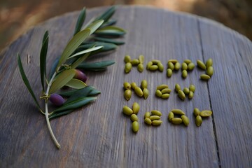 Happy new year message with olives and greenery