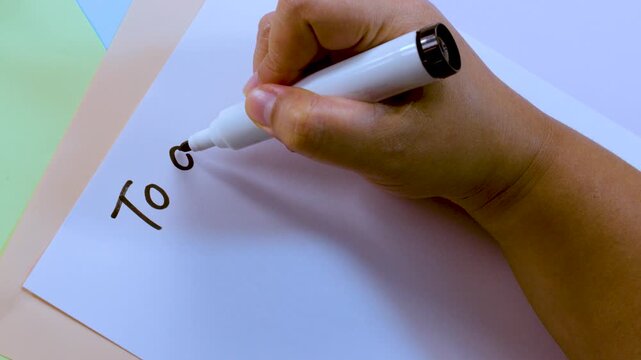 Hand Writing To Do List on White Paper