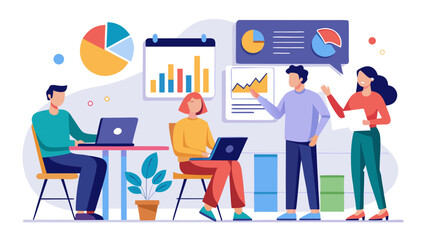 A group of people are working together in a meeting room. There are two men and two women, all sitting at a table with laptops. A potted plant is in the room, and a clock is visible on the wall