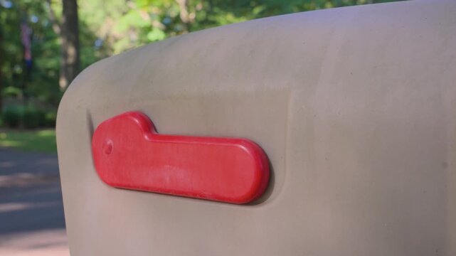 Close up look at the plastic flag on a mailbox.
