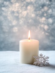 Tranquil winter scene with burning white candle and soft snowflake