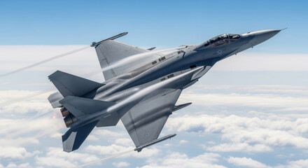 Modern military fighter jet soaring through clear sky above the clouds with vapor trails highlighting high speed aerial maneuvers