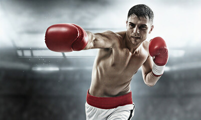 A determined male boxer delivers a powerful jab in a brightly lit arena, showcasing strength and focus during an intense professional fight or training session with blurred crowd in background