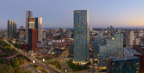 Aerial long exposure image over Princess Road showing Manchester’s skyline and the Mancunian Way at sunrise.