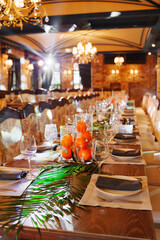 Cozy restaurant with a fresh fruit and greenery dining setup