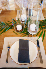 Elegant table setting with candles and decorative elements for special occasion