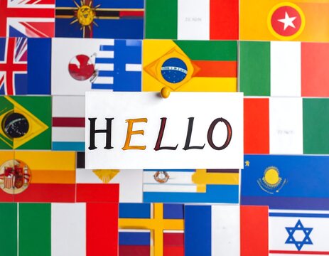 A "HELLO" note pinned against diverse world flags. A celebration of communication and cultures. International concept