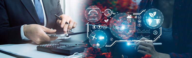 Selective focus. Architect team planning design apply renewable or solar energy on architectural building model with virtual reality technology hologram. Alternative green energy in future concept.
