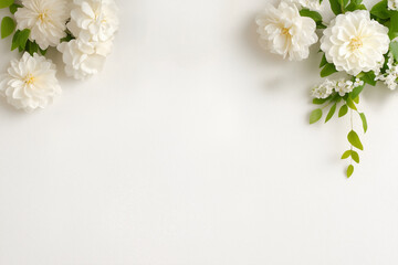 Elegant white flowers with green leaves on bright minimal background