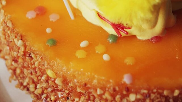 La mona de pascua is a traditional Spanish dessert, eaten primarily during Holy Week and especially on Easter Monday. It consists of a sweet, traditionally a roscon or sponge cake, decorated with