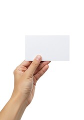 Fototapeta premium A person's hand holding a blank white rectangular card against a clean, isolated background.
