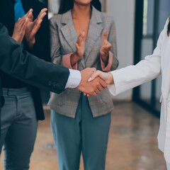Business success. Business people handshake agreement confirmed in the investment business. Successful business people meeting together.
