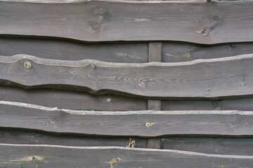 old wooden weathered curved fence