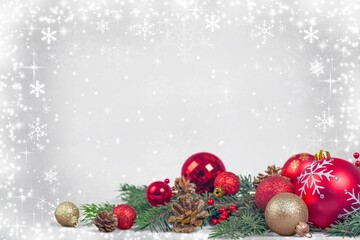 Christmas-themed flat lay with pine branches, red and gold baubles, pinecones, candy canes, and gift boxes on snowy gradient background. Sparkling lights and snowflakes evoke warmth, celebration, and 