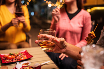 young couple celebrating with champagne at night
