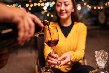 young woman with glass of wine