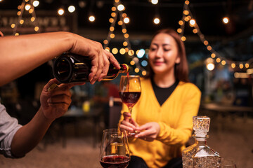 bartender pouring beer into glass