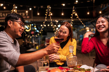 young couple celebrating with champagne at night